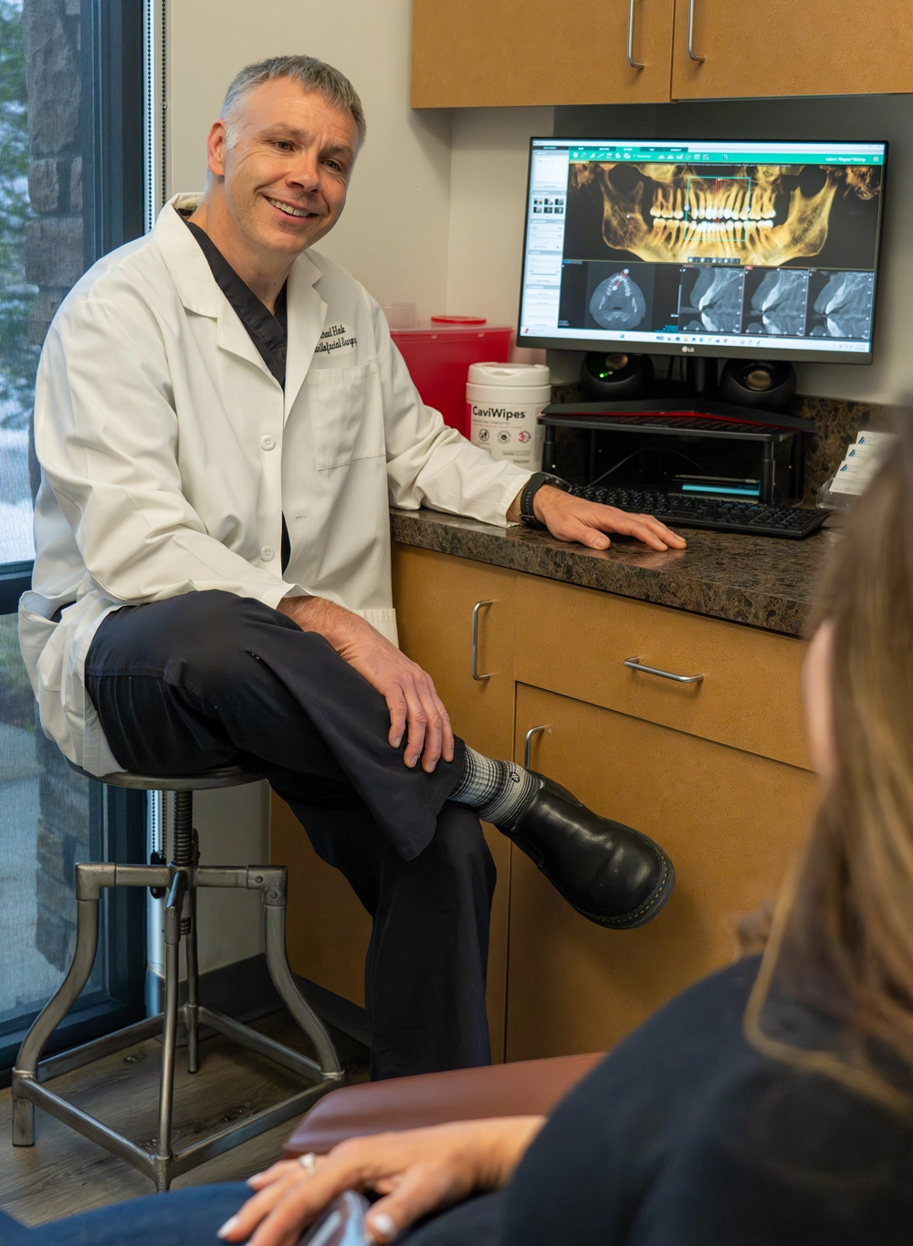 Doctor consulting with patient about orthognathic surgery at Colorado Oral Surgery