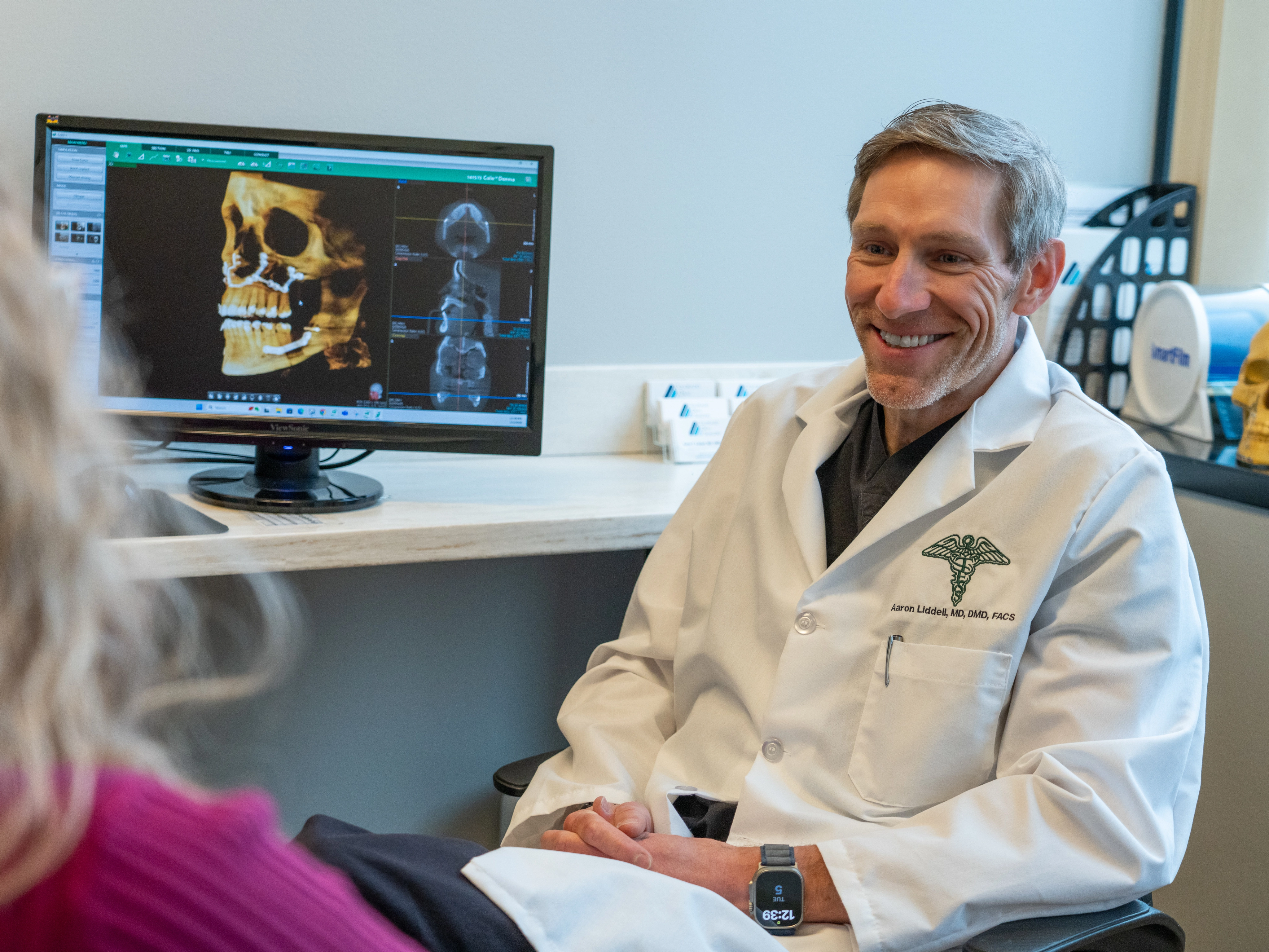 Dr. Liddell consulting with patient about jaw surgery at Colorado Oral Surgery